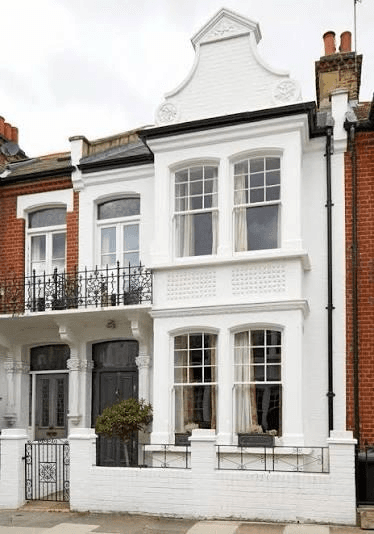 White-rendered period townhouse frontage